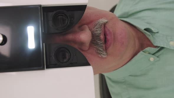 Elderly Man Doing Eye Vision Test