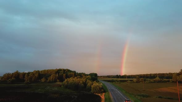 Dark Thunderstorm Clouds and Double Rainbow Over Forest and Wheat Field, Areal Dron Shoot.