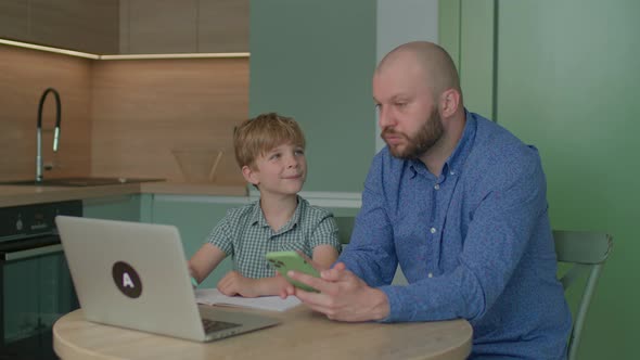 Kid Asking Father for Help with Online Homework