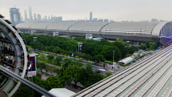 Canton Fair Building Roofs Among Trees and Road Timelapse