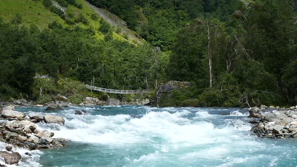 Wild clear blue stream in Morkidsdalen park 