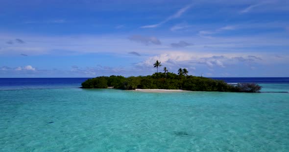 Wide angle birds eye abstract view of a sunshine white sandy paradise beach and blue ocean backgroun