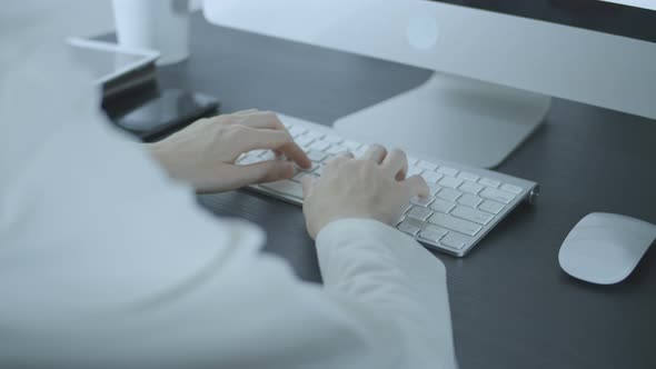 Secretary Working With Computer