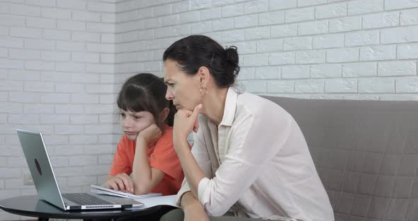 Mother Checking Child Homework