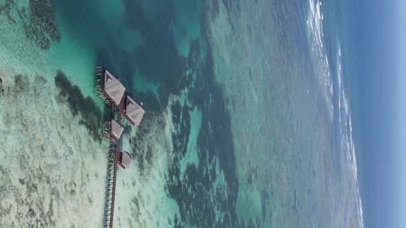 Vertical Video of the Ocean Near the Coast of Zanzibar Tanzania Aerial View