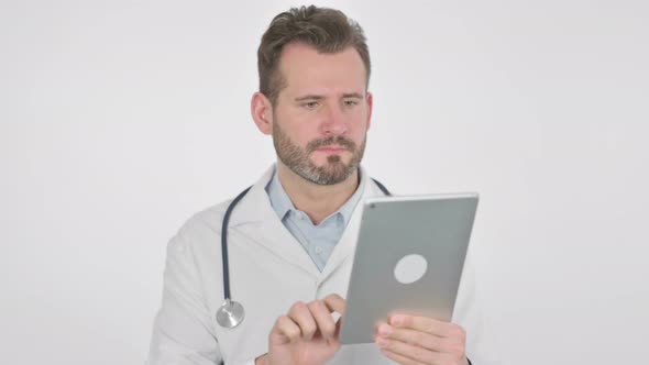 Portrait of Middle Aged Doctor Using Digital Tablet