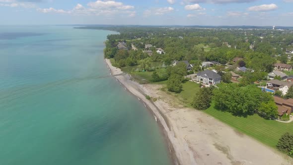 real estate aerial wealthy community on colorful lake edge 4k