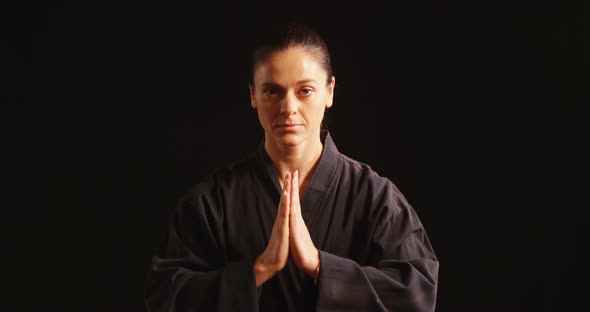 Karate player in prayer pose