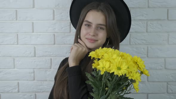 Beautiful girl with yellow flowers.