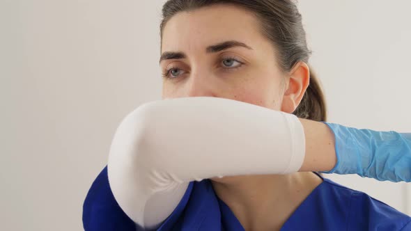 Doctor or Nurse Coughing Covering Mouth with Elbow