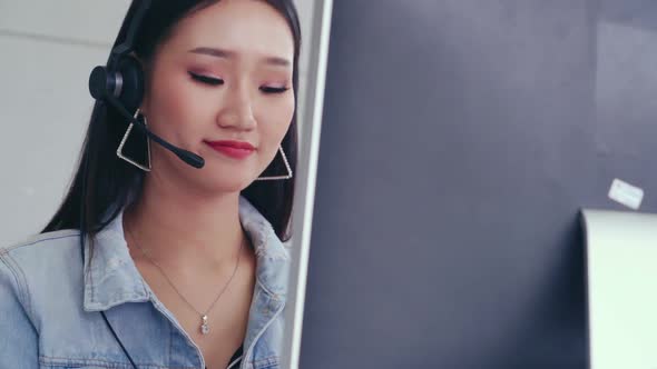 Customer Support Agent or Call Center with Headset Talking to Customer on Phone