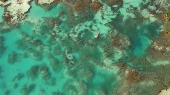 People Riding Kayak in Los Rapidos Lagoon in Bacalar Mexico