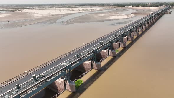 Aerial View Of Punjnad Barrage Dam Structure. Dolly Shot