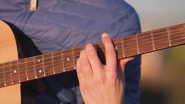 Man playing guitar with slow motion shoot music musician classic chord acoustic