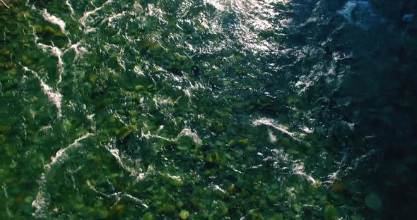 Low Altitude Flight Over Fresh Fast Mountain River with Rocks at Sunny Summer Morning