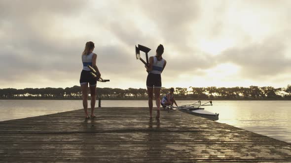 Female rowing team training on a river