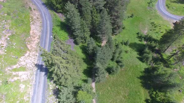 Aerial view of mountain bikers on a scenic singletrack trail