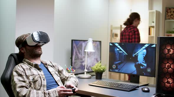 Bearded Man Sitting on Gaming Chair Playing Games