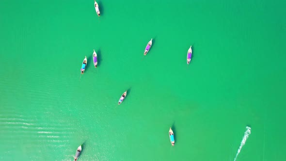 Passenger boats moored on the shores of the beautiful Andaman Sea.