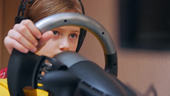 Attentive Girl Playing On A Car Simulator