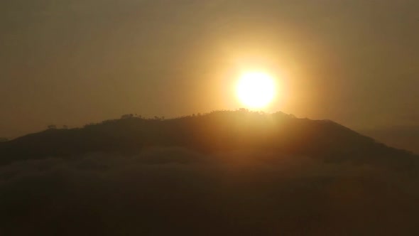 Timelapse of foggy sunrise on the Little Adam's Peak in Ella, Sri Lanka