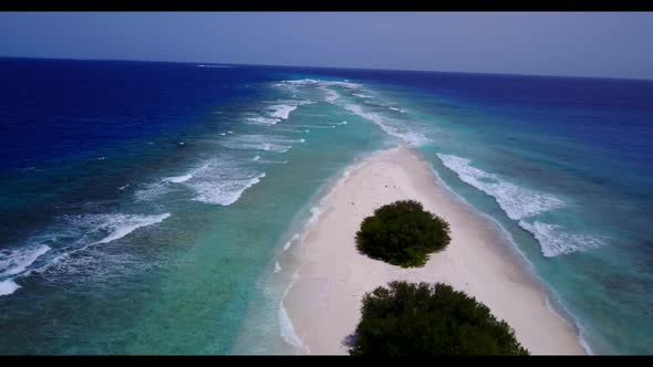 Aerial drone scenery of exotic tourist beach voyage by aqua blue ocean and white sand background of 