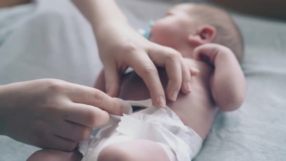 Mother Hands Treat Newborn Son Umbilical Cord Care