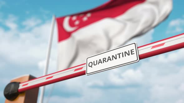 Barrier with QUARANTINE Sign Being Open at Flag of Singapore