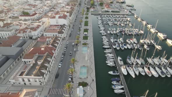 Aerial Overheard View Over Vila Real De Santo Antonio Marina In Portugal During Sunset. Dolly Forwar