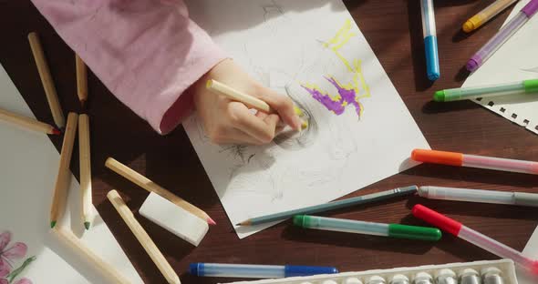 Artist Hands Painting on White Paper Using Colourful Markers Top View