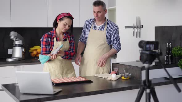 Video Stream of Positive Couple at Kitchen Making Macaroons at Home
