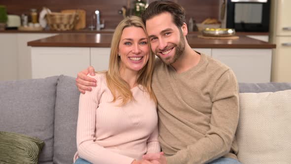 Closeup Portrait of Happy Caucasian Couple in Love Hugging and Looking at the Camera