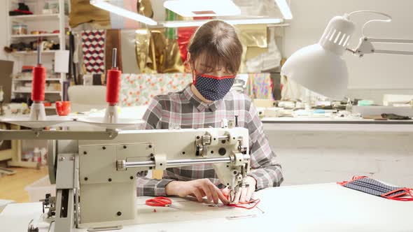 Seamstress Using Sewing Machine for Making Facial Mask