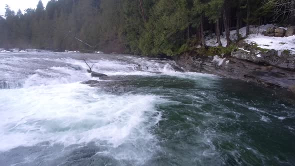 Aerial flight over the Puntledge River in Courtenay, BC , Canada.