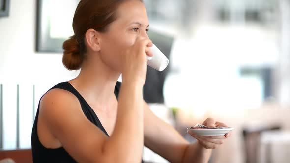 Young Woman Enjoying Coffee