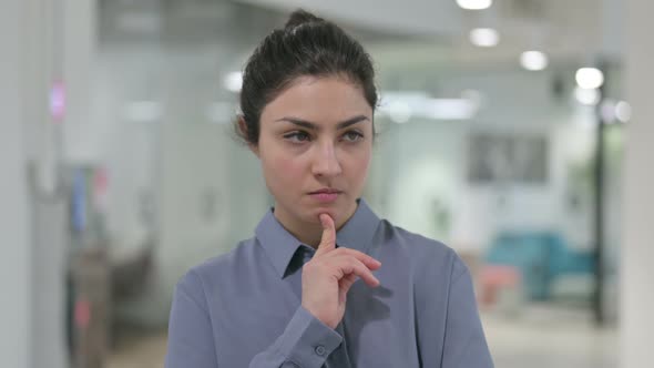 Portrait of Pensive Indian Woman Thinking Getting Idea