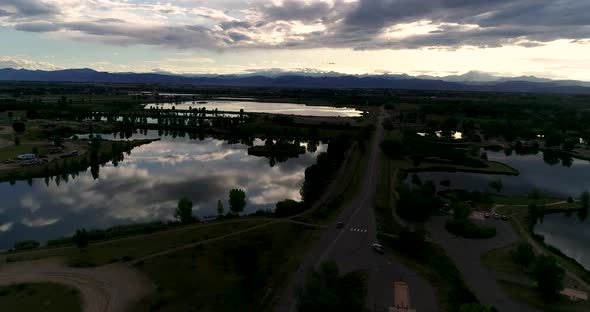 Be humbled in awe at this sunset taken by drone of the Rocky Mountains with reflections in the lakes