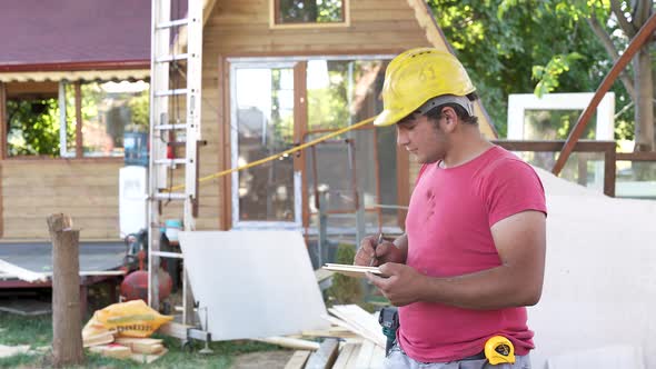 Builder taking notes for home renovation