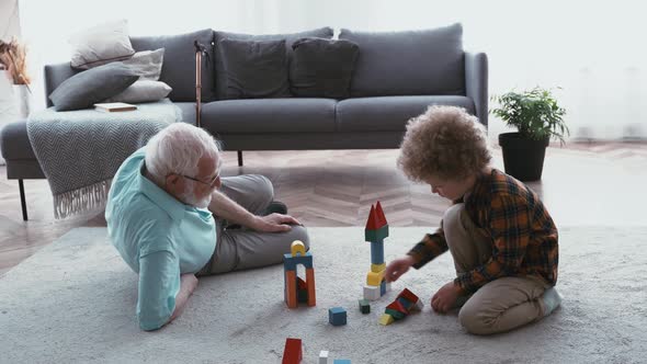 Grandparents plying with grandson.