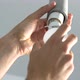 Male hands screwing electricity bulb into switch lampholder - VideoHive Item for Sale