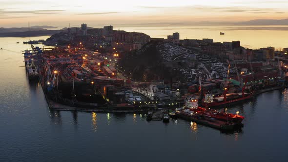 Drone View of the Cargo Terminal with Port Cranes at Sunset