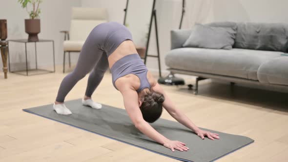 Indian Woman Doing Pushups on Yoga Mat at Home