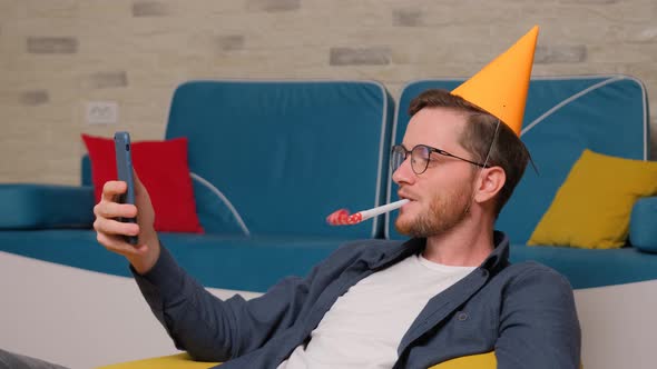 Man Celebrating Birthday, Talking Online with His Friends.