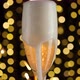 Pouring champagne into a glass against a background of fireworks and golden shining lights - VideoHive Item for Sale