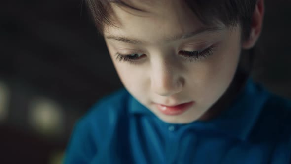 Portrait Serious Pupil Watching Tablet Screen Surfing Internet on School Break