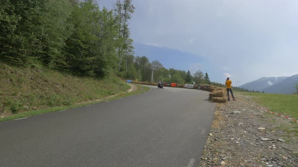 Longboarder stopping on the road