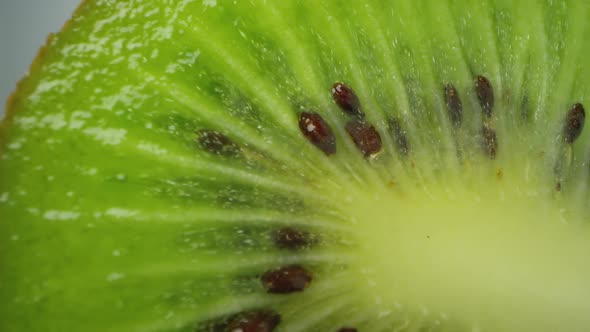 Macro view of sliced kiwi slowly rotating