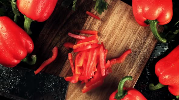 Chopped Sweet Peppers Fall on a Cutting Board