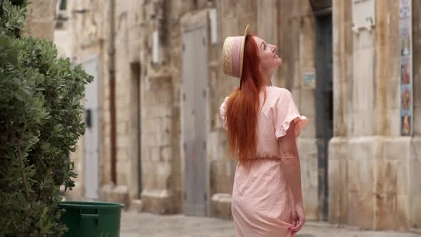 Young Female Tourist Examines Streets of Old City in Italy Close Up