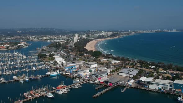 A high view of a boat harbour and coastline along the Australian sunshine coast of Mooloolaba Queens